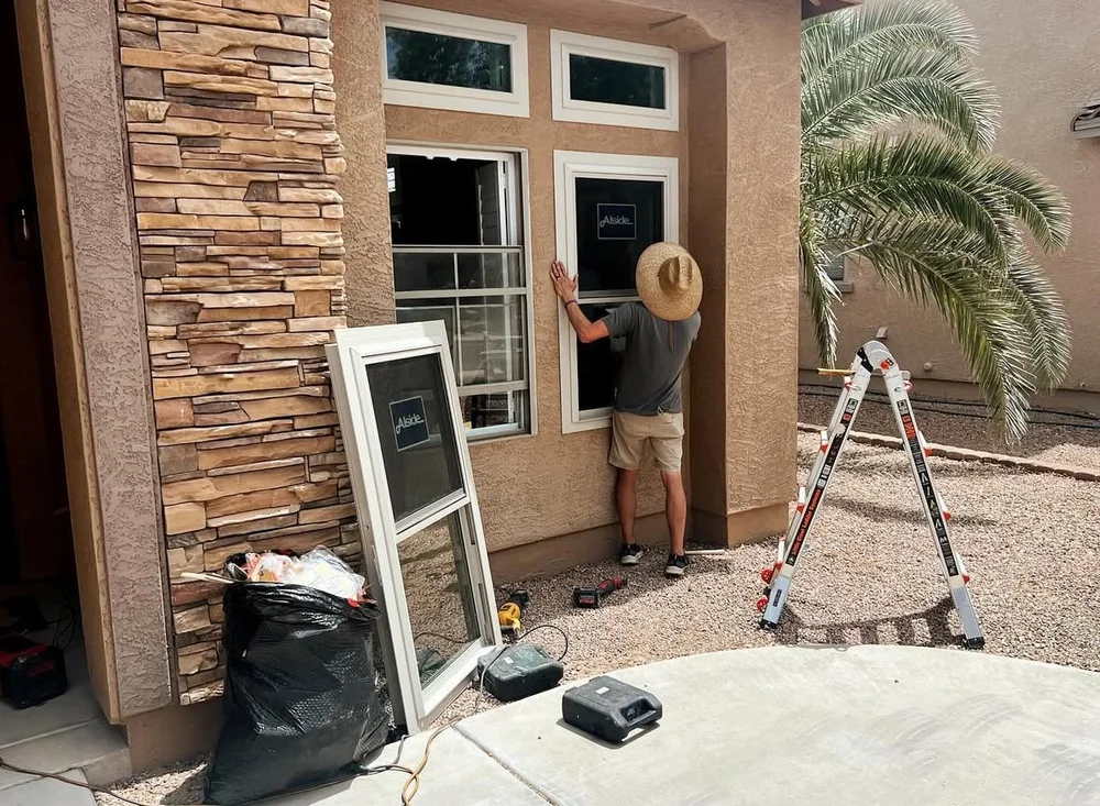 Nova Windows crew installing a window